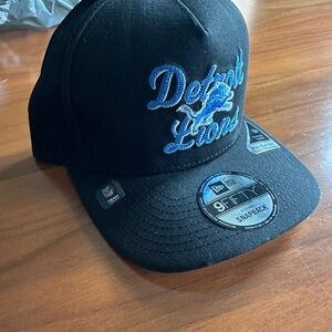 New Era Black Hat with Blue Embroidered Script and Lion